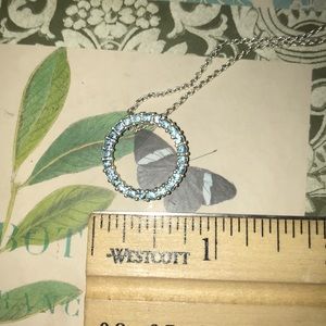 Light blue circle pendant on a silver chain